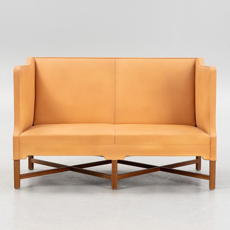 Kaare Klint, a leather upholstered model 4118 sofa, Rud Rasmusseun, Denmark, 1980's.