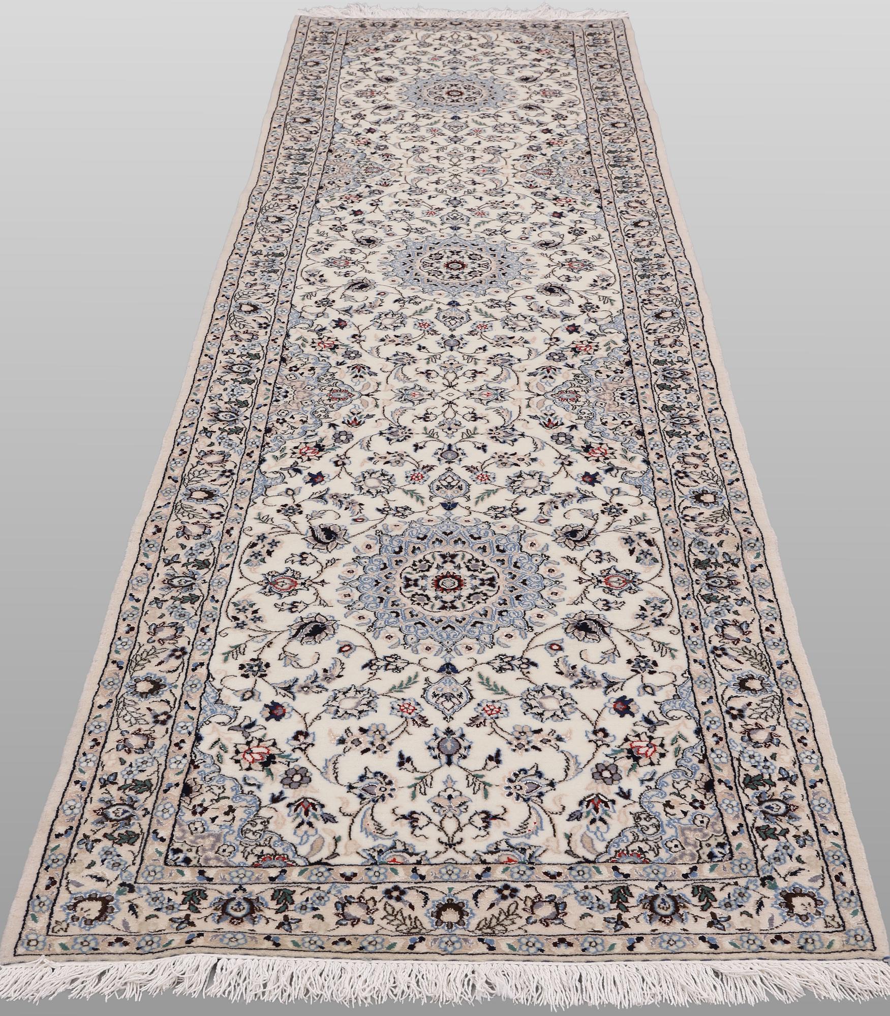 A Nain part silk runner carpet, 342 x 81 cm.