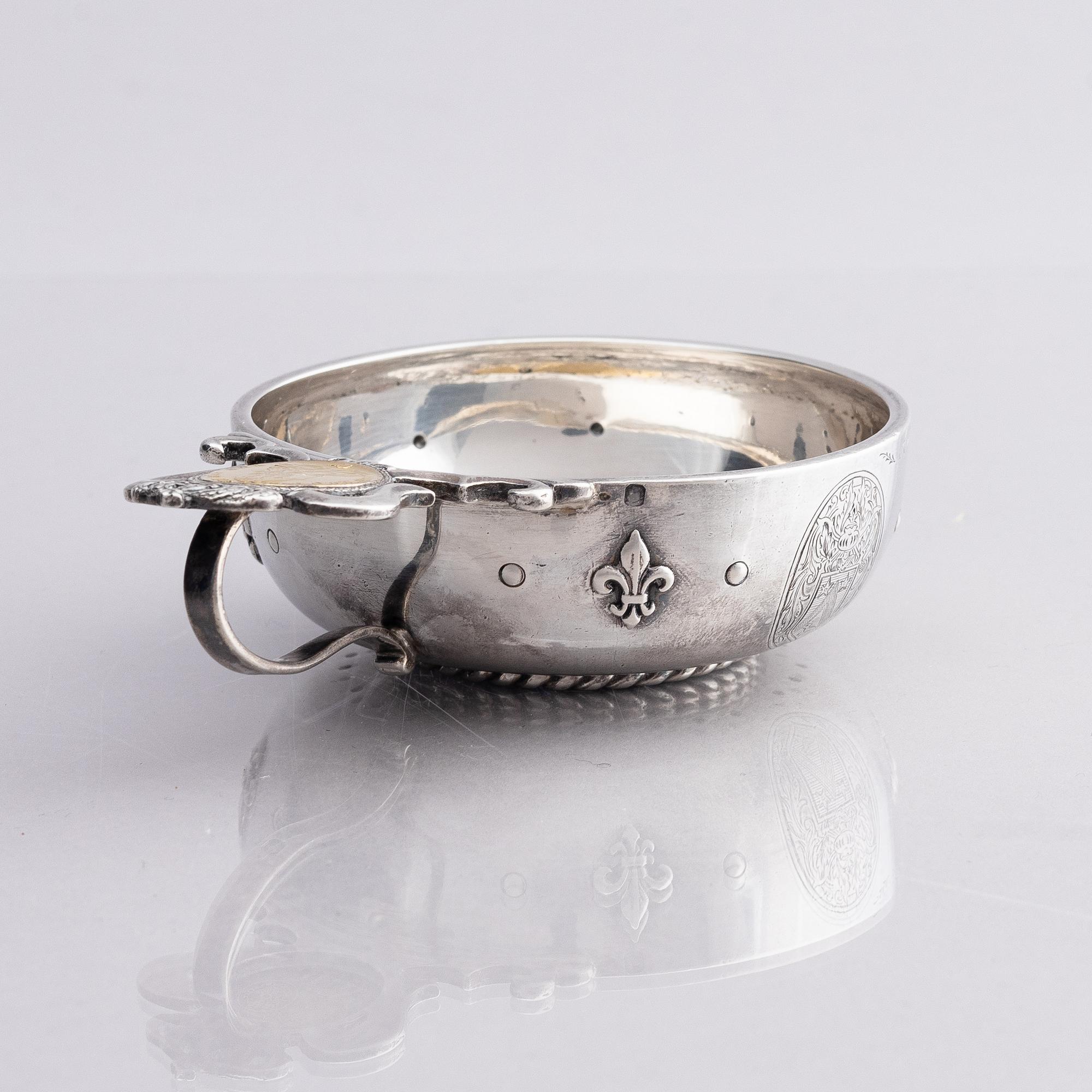 An 18th century French parcel-gilt silver tasse du vin (wine taster).