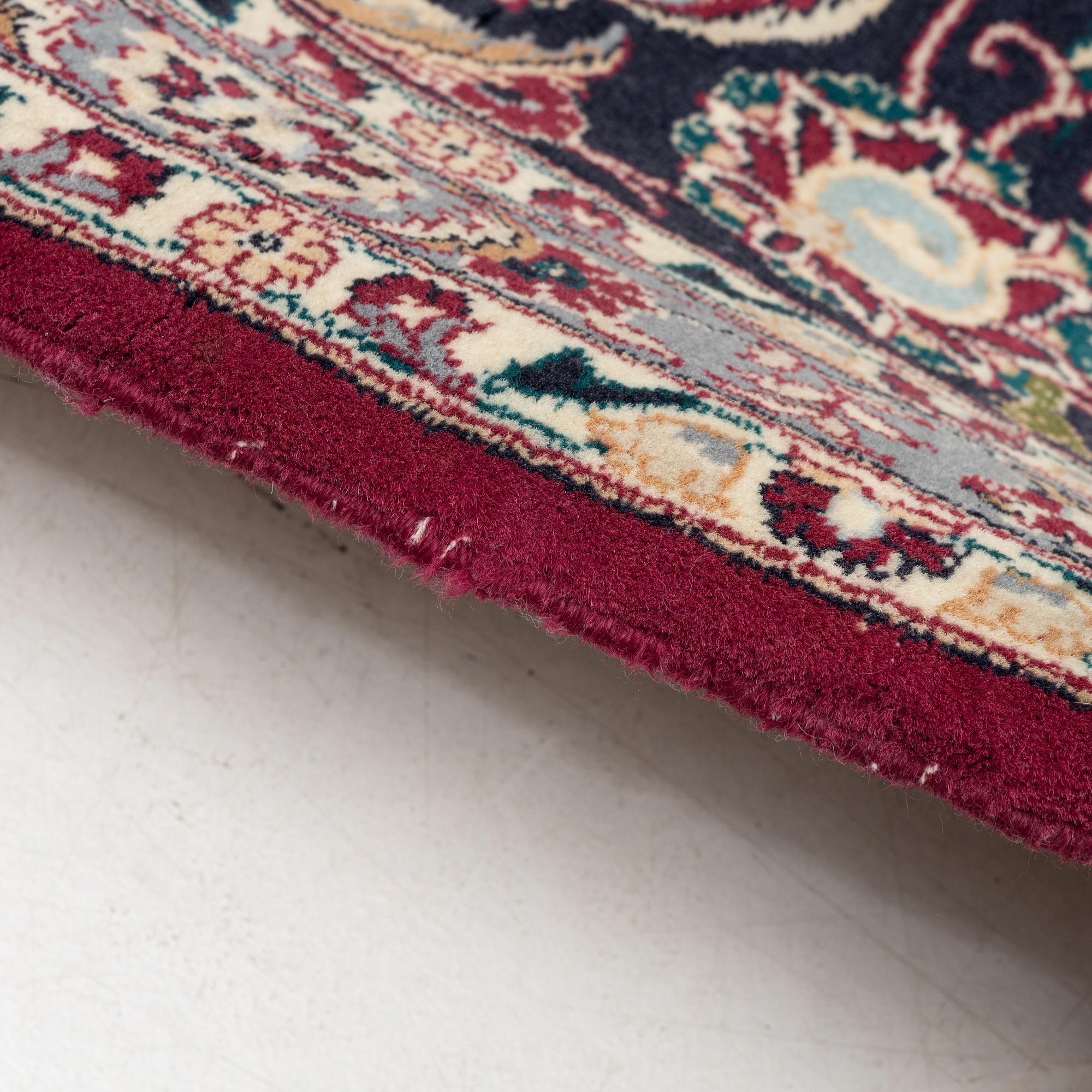 An oriental carpet, a. 378 x 278 cm.