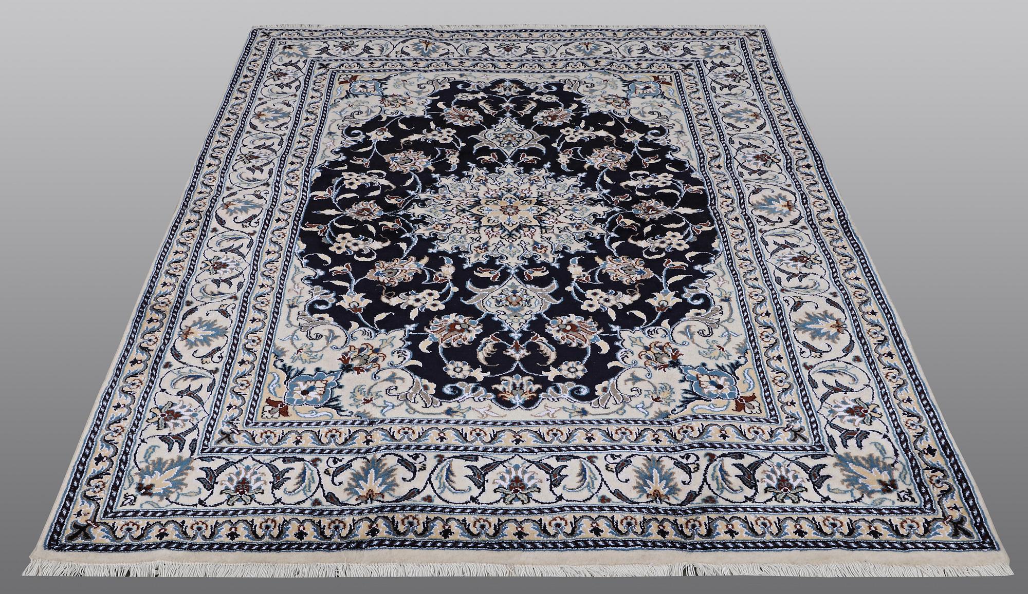 A carpet, Nain, part silk, ca 212 x 153 cm.