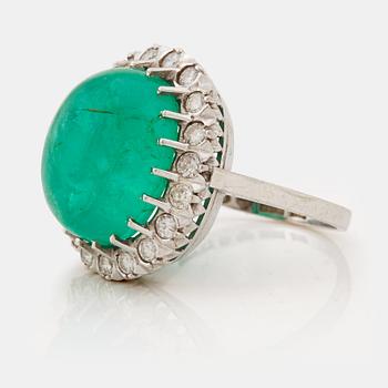 A emerald and brilliant cut diamond ring.