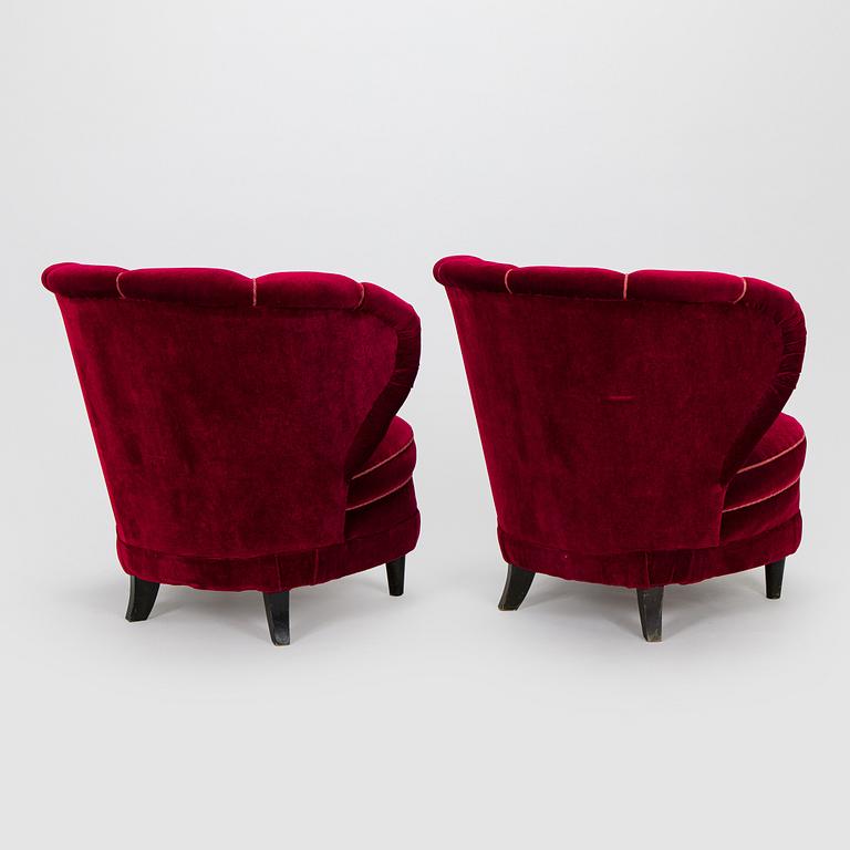 A pair of mid-20th century armchairs.