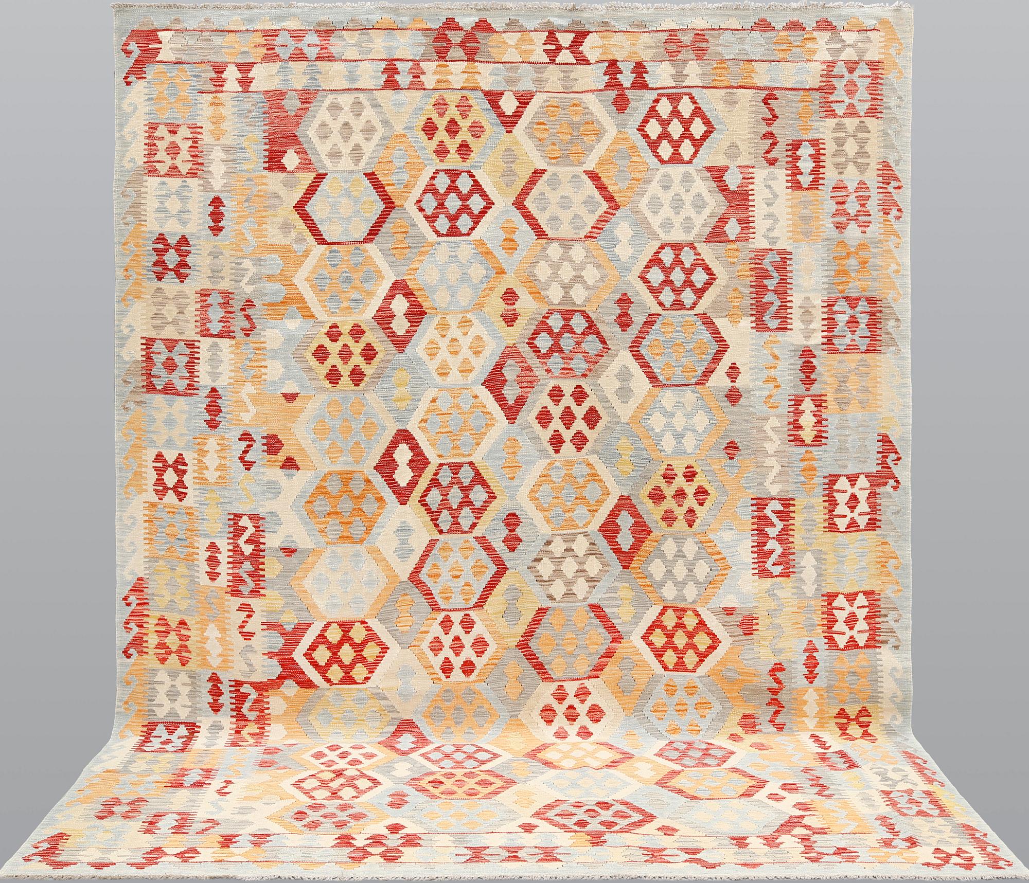 A kilim carpet, ca 340 x 259 cm.