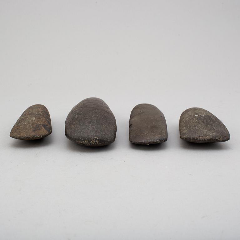 Four neolithic stone axes.