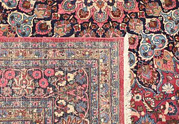 A semi-antique Meshed carpet, approx. 399 x 311 cm.