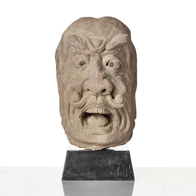 A sanstone sculpture of a Luohan, Yuanstyle.