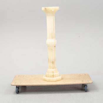 A 20th century alabaster pedestal.