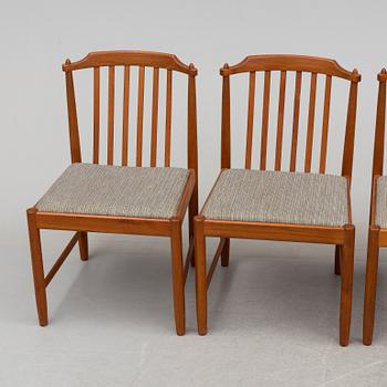 A 20th century table and four chairs.