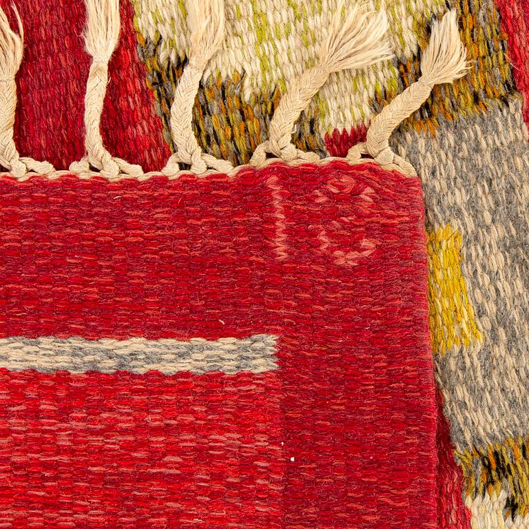 A Swedish flat weave rug signed IS ca 240 x 169 cm.
