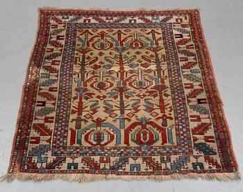 A rug, antique Anatolian/Caucasian, ca 148-149 x 104,5-110 cm (as well as 1-1,5 cm flat weave at one end).