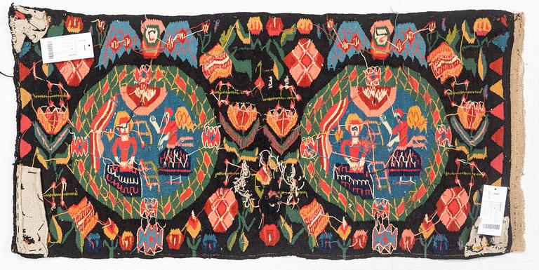 A carrige cushion, "Bebådelsen", tapestry weave, ca 105 x 52 cm, Skåne, 1800-1830.