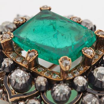 An emerald, black enamel and old cut diamond brooch. 19th century.