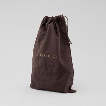 GUCCI, a "Sunshine Camera" bag.