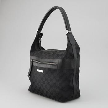 GUCCI, a canvas and leather bag.