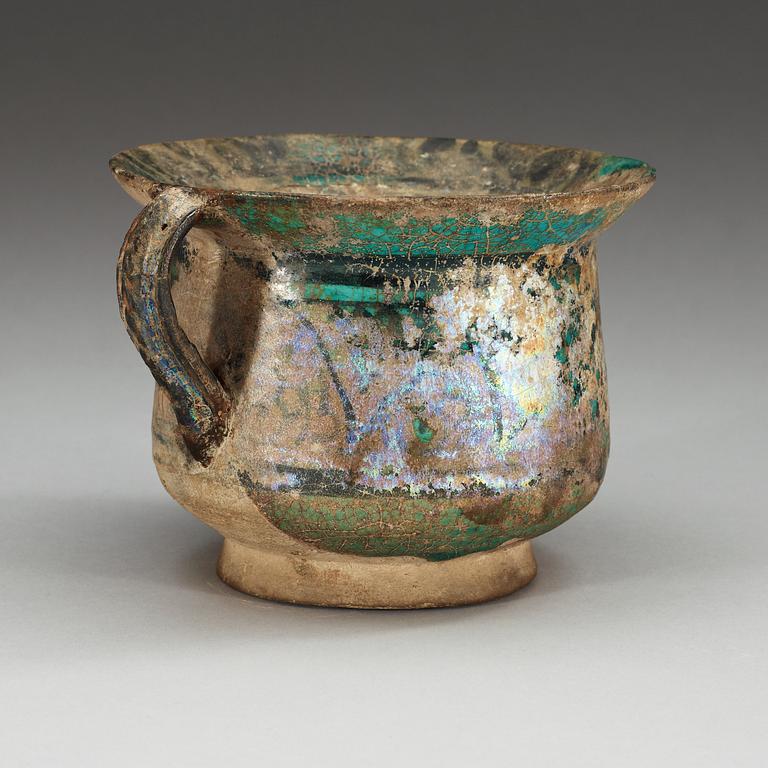 JAR, pottery. Turquoise glaze with black decoration. Persia 13th-14th century.