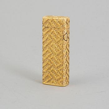 A Dunhill gold plated lighter.