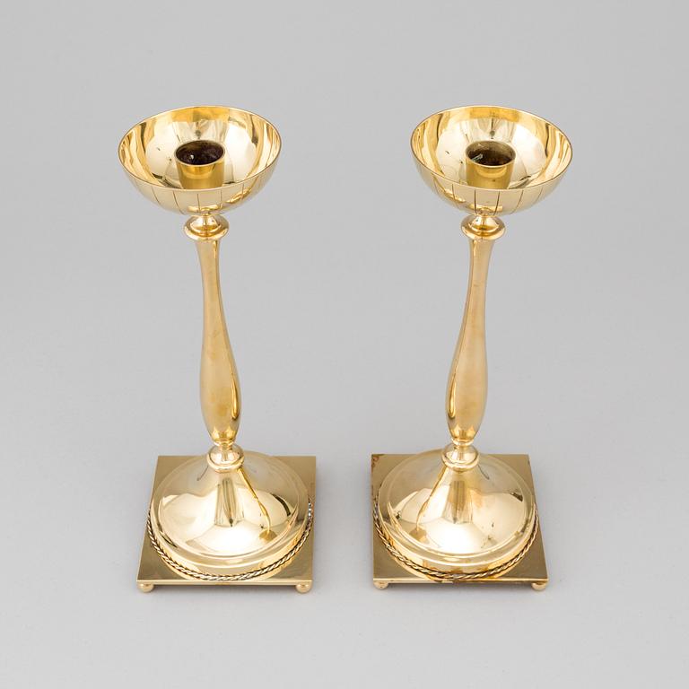 A pair of mid 20th century brass candlesticks by Gunnar Ander for Ystad Metall.