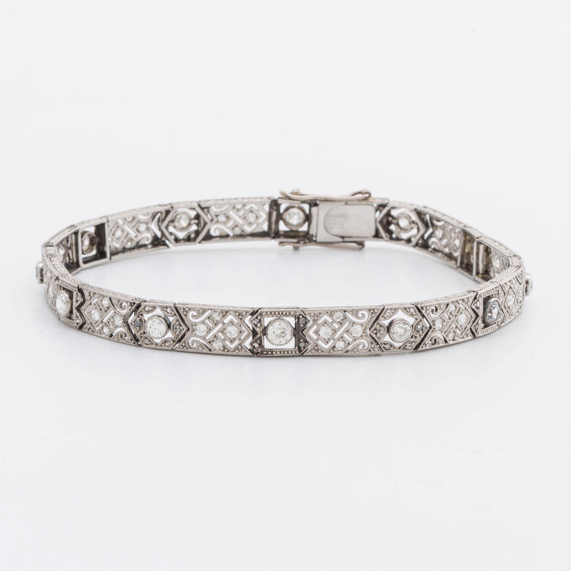 DIAMOND BRACELET, probably platinum, old and rose-cut diamonds approx 2 ct in total, 1 large stone not diamond.