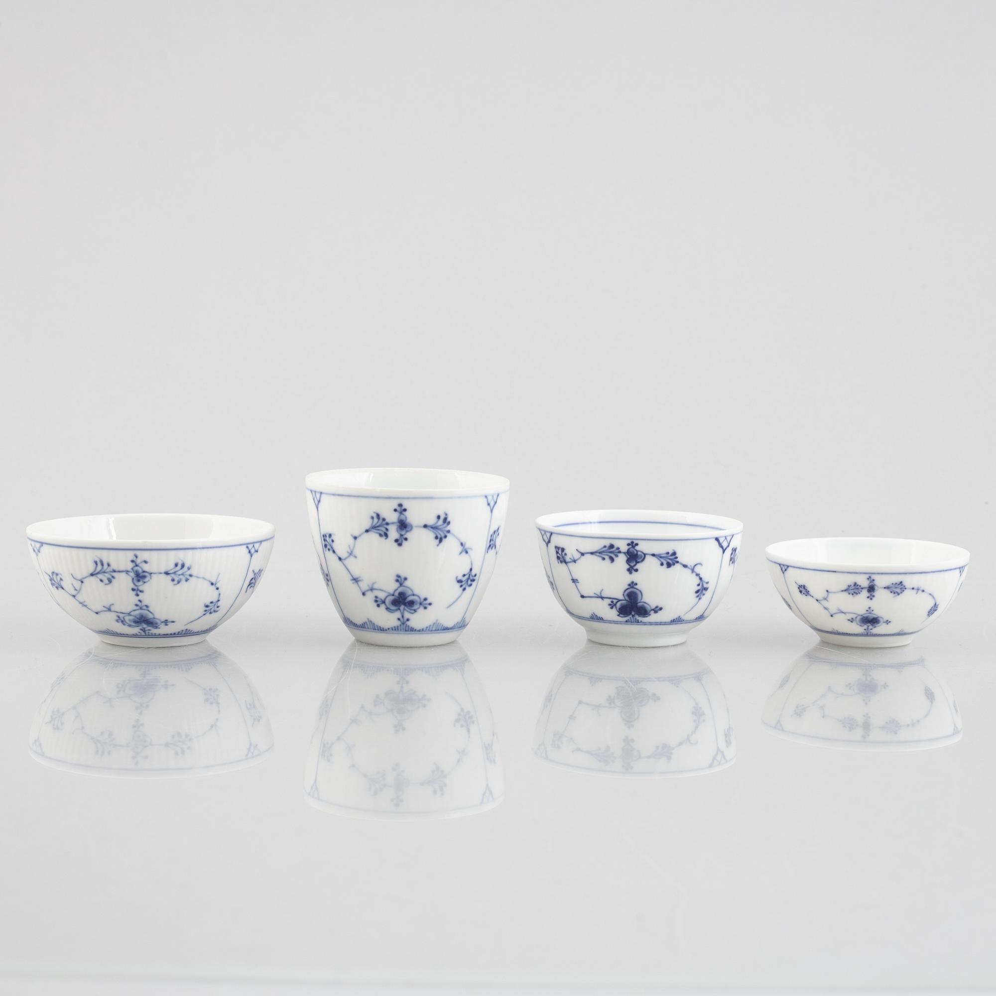 A group of four 'Blue Fluted' / 'Musselmalet rifflet' cups with saucers, Royal Copenhagen, 19th century and later.