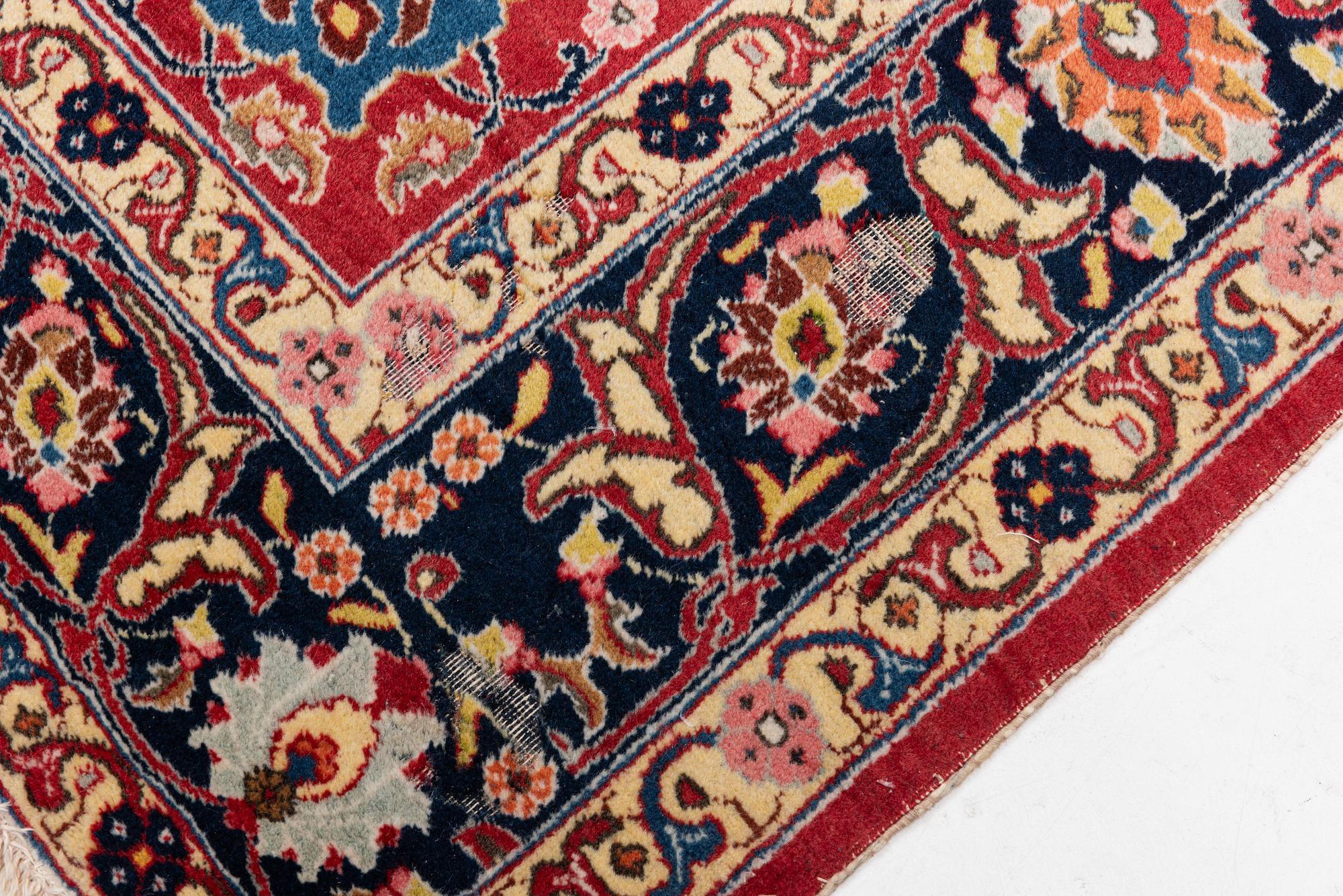 A semi-antique Tabriz carpet, c 358 x 248 cm.
