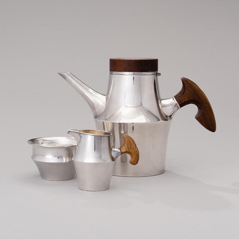 A coffee pot, sugar bowl and creamer signed TW. Silver 916, Kultakeskus, Hämeenlinna 1962 and -61.