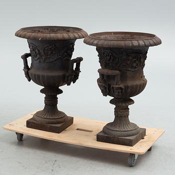 A pair of cast-iron garden urns, early 20th century,.