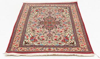 A Ghom rug, c. 160 x 105 cm.