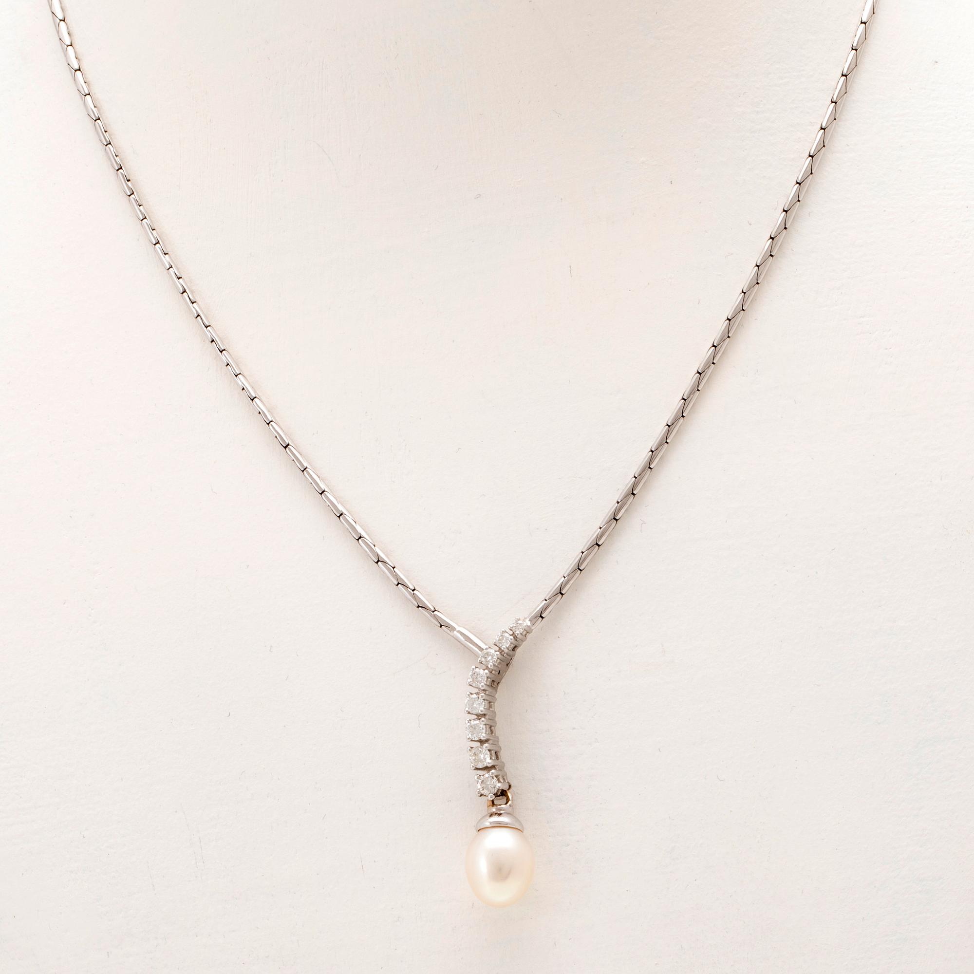 An 18K white gold necklace set with round brilliant-cut diamonds and a cultured pearl.