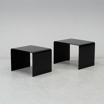 Two modern glass tables.