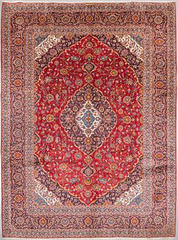 A Keshan rug, signed, 409 x 308 cm.