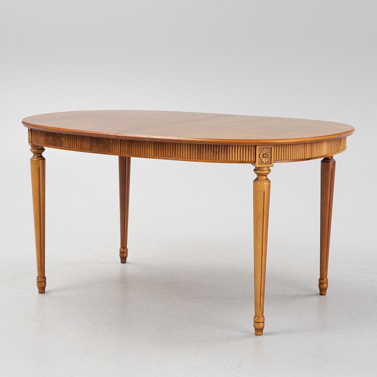 A Gustavian style dining table with two armchairs and four chairs, late 20th century.
