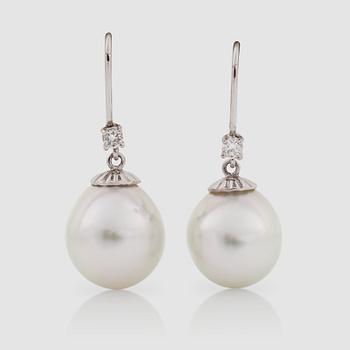 1287. A pair of cultured pearl, Ø 13 mm, and diamond 0.19 ct in total, earrings.