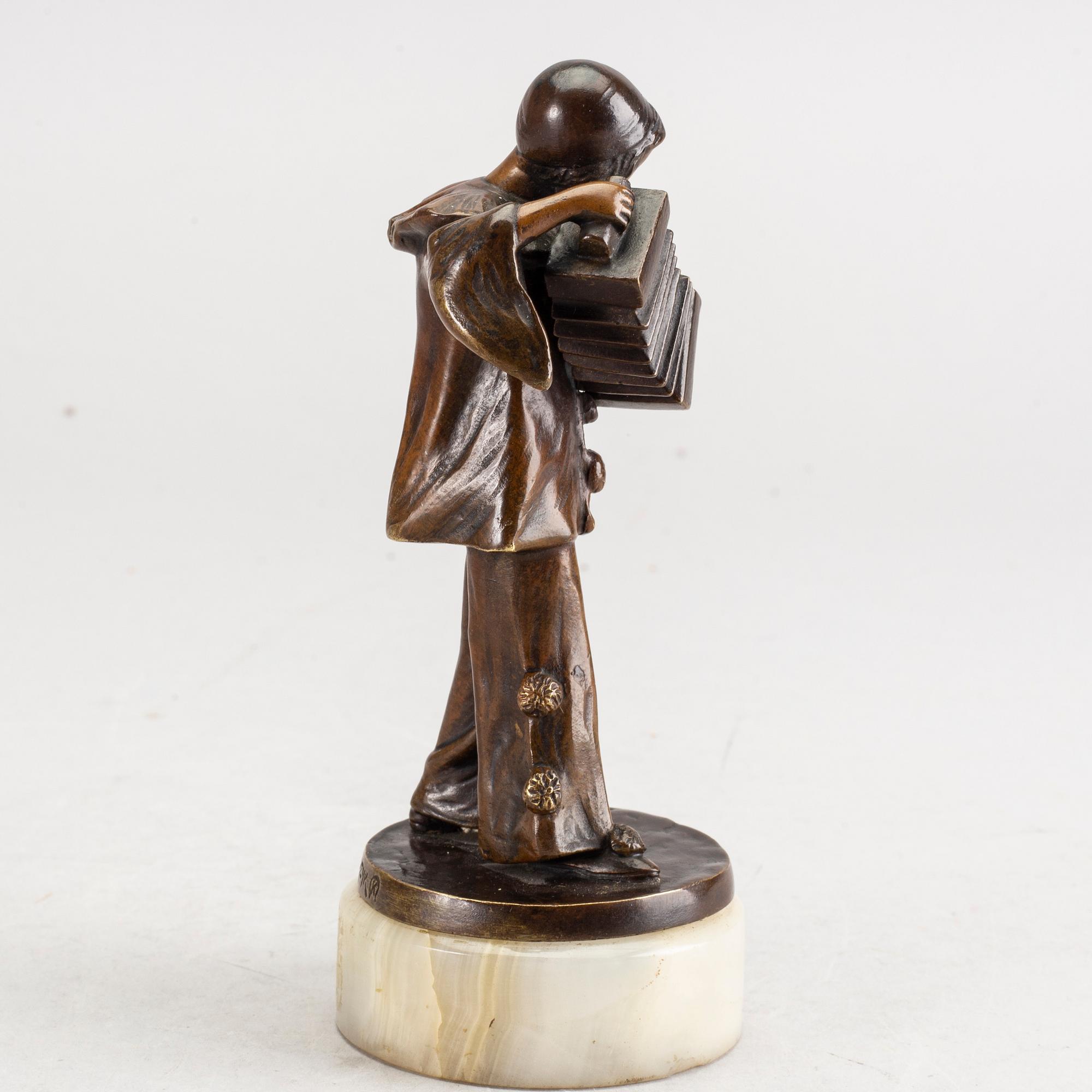 An early 20th century bronze with alabaster base by Francizek Jozef Kucharzyk.