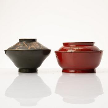 A group of nine Japanese lacquer bowls with covers, Meiji and 20th century.