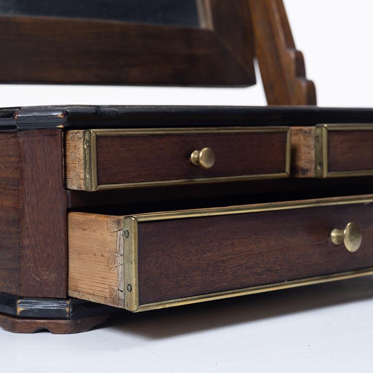 A mahogany table mirror, Sweden, dated 1820.