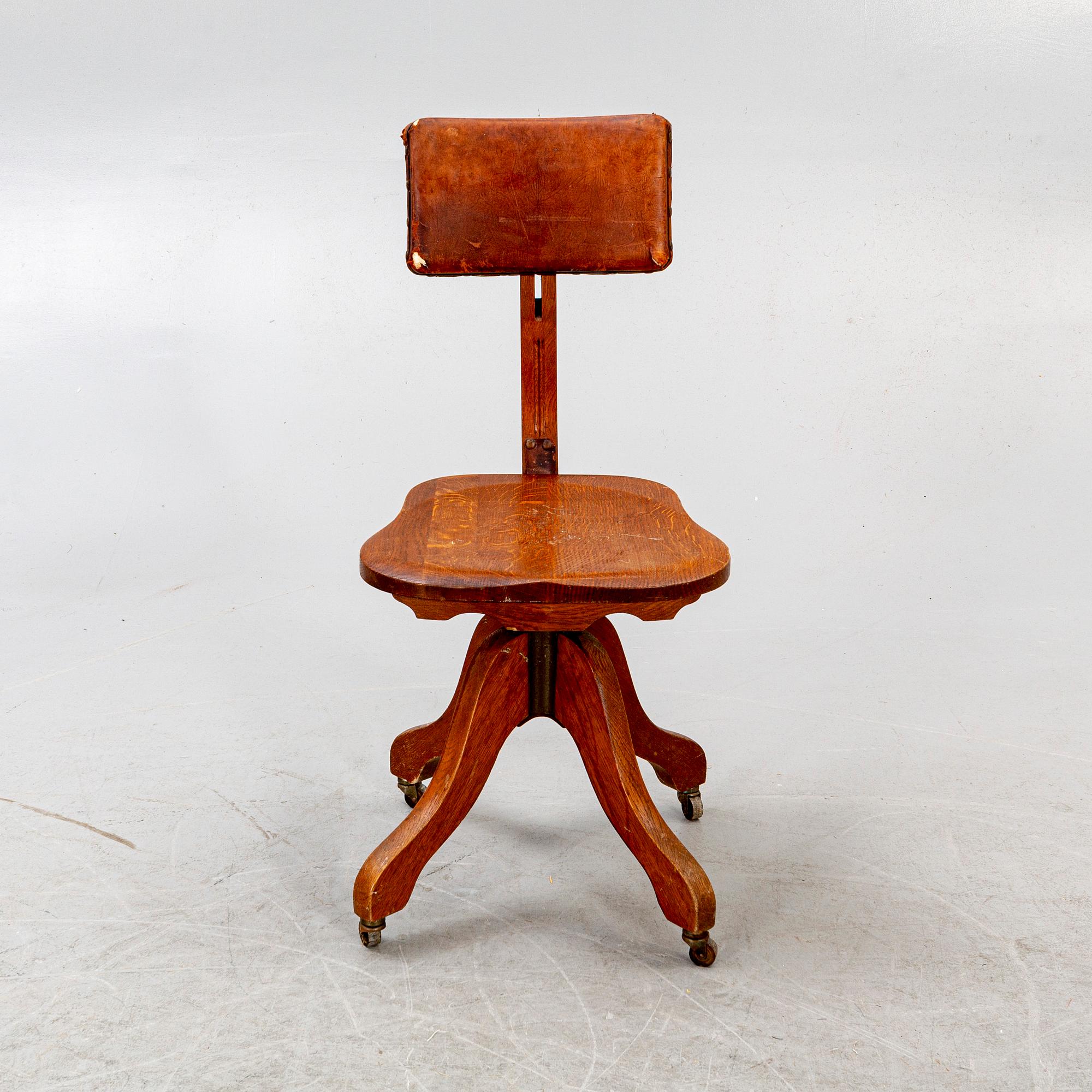 An early 1900s oak office chair.
