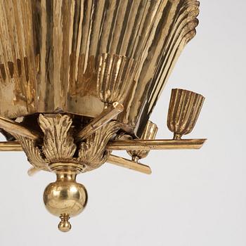 A.W. Borgh, a pair of Swedish Grace brass chandeliers, probably 1920-1930's.