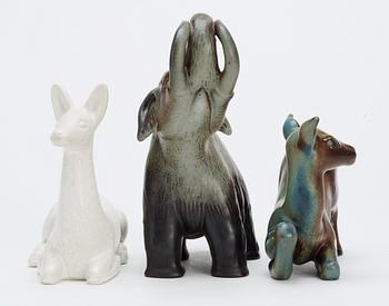 Three Gunnar Nylund stoneware figures, two deer and a mammoth, Rörstrand.