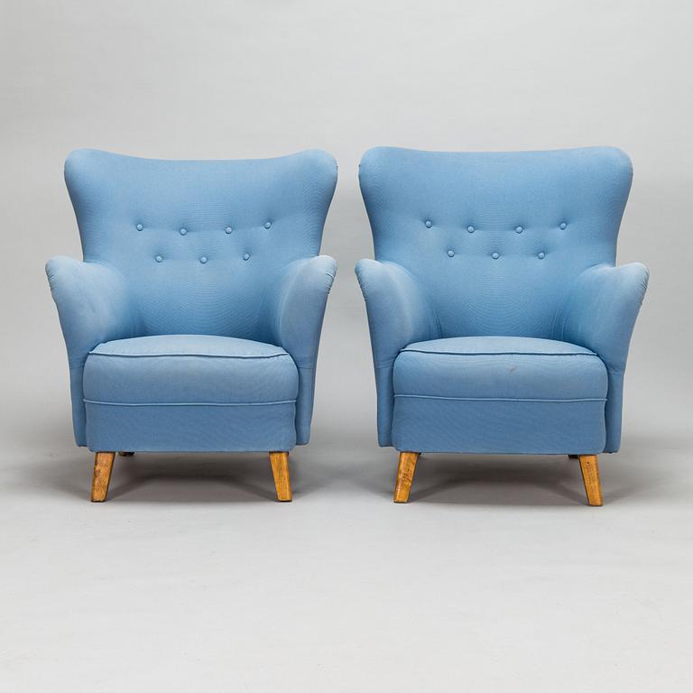 A pair of mid-20th-century armchairs.