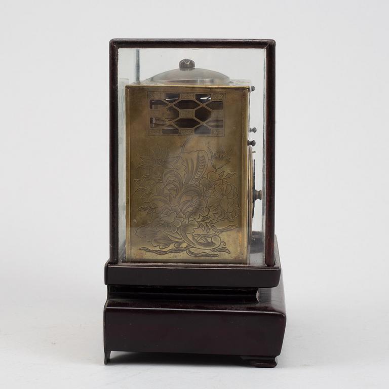 A Japanese brass mantel clock, 19th Century.