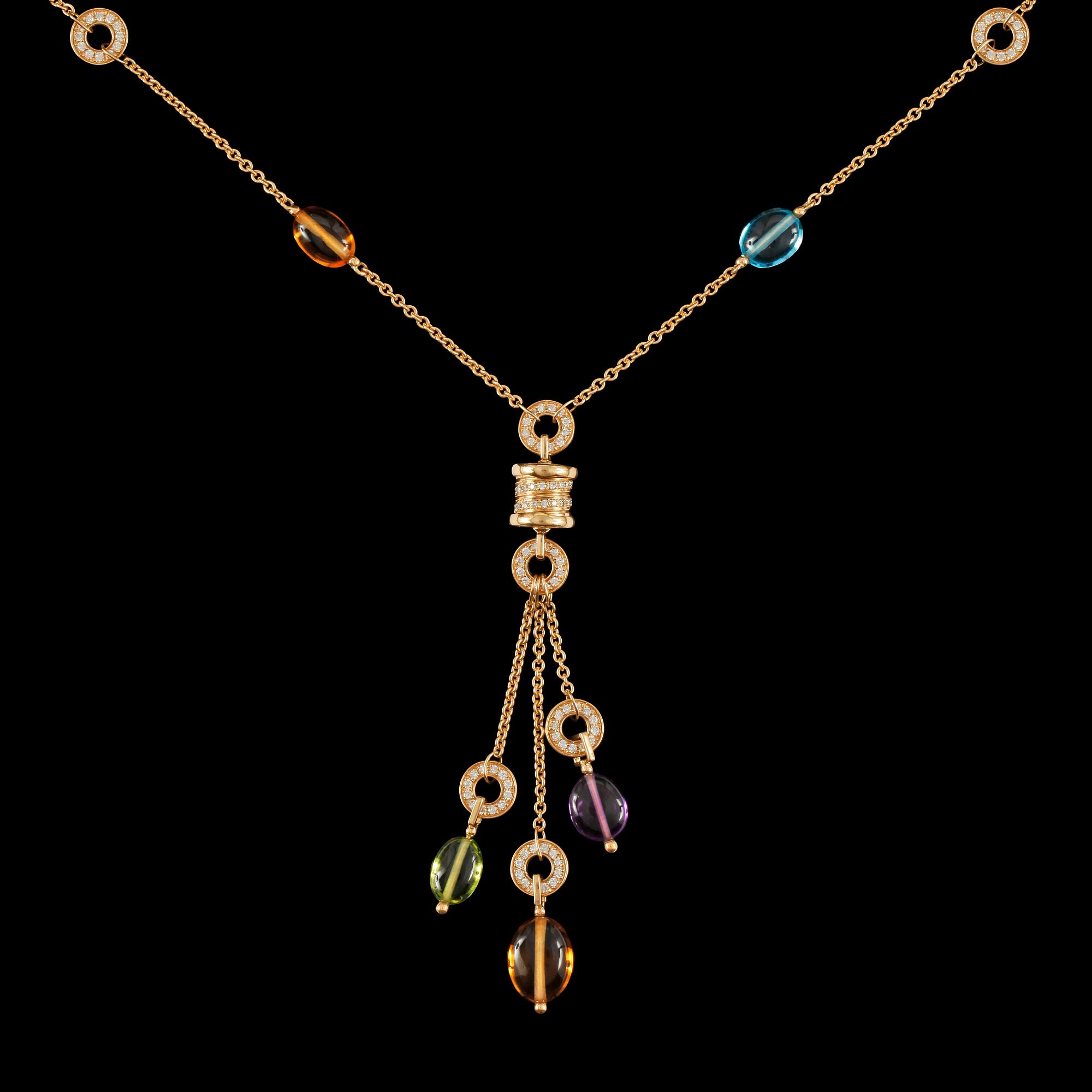 A pendant necklace in 18K yellow gold with peridot, amethyst, blue topaz, citrine quartz and pavé diamonds.