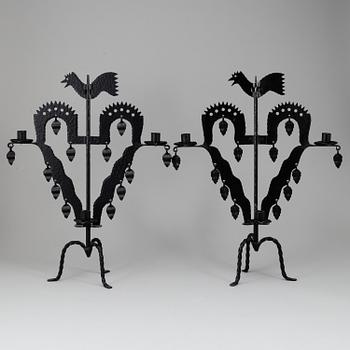 KANDELABRAR , 2 st smide, "Tuppljusstake" Design Gustaf Ancarkrona, Käck & Hedbys, Leksand.
