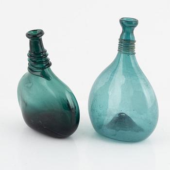 A set of two glass bottles, 19th century.