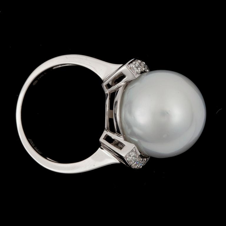 A cultured South sea pearl Ø 16.4 mm and diamond ring. Total carat weight of diamonds circa 0.50 ct.
