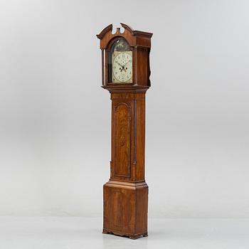 A mahognay long case clock from around the year 1800, H Bunyan Lincoln.