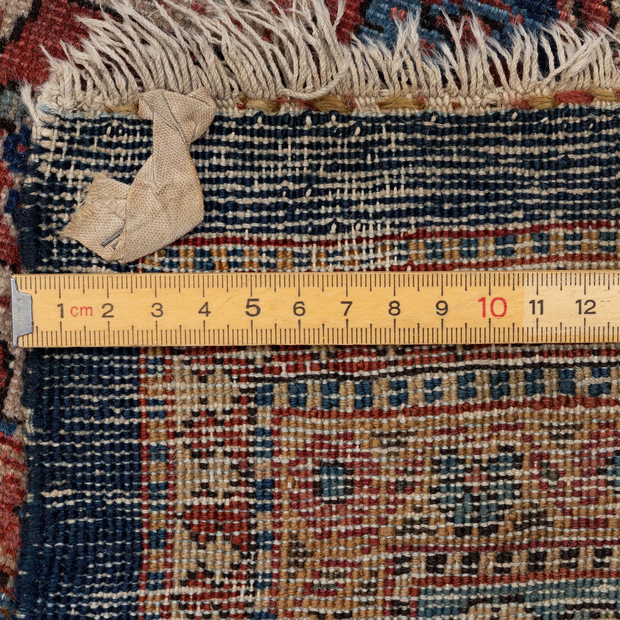 An oriental carpet, c. 425 x 305 cm.