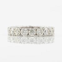 Ring in 18K white gold with round brilliant-cut diamonds, eternity band.