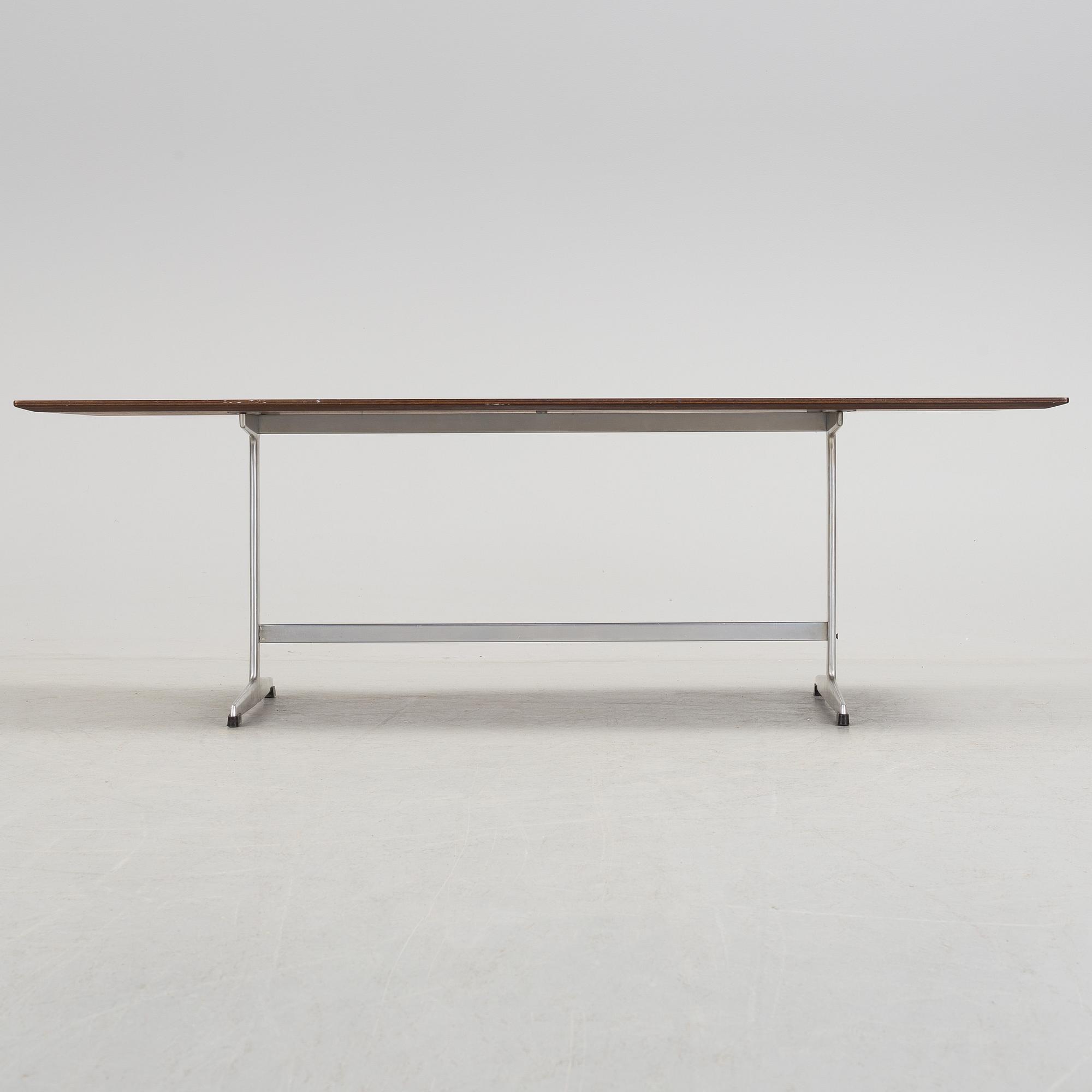A rosewood top and aluminium coffee table, model 3315 by Fritz Hansen, Denmark 1968.