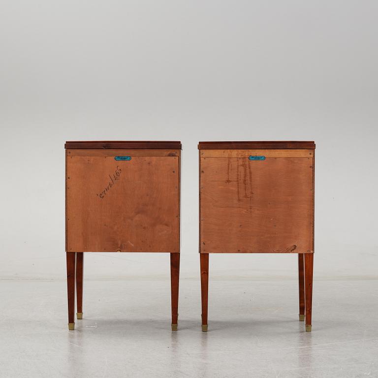 A pair of mahgany veneered bedside cabinets, early 20th Century.